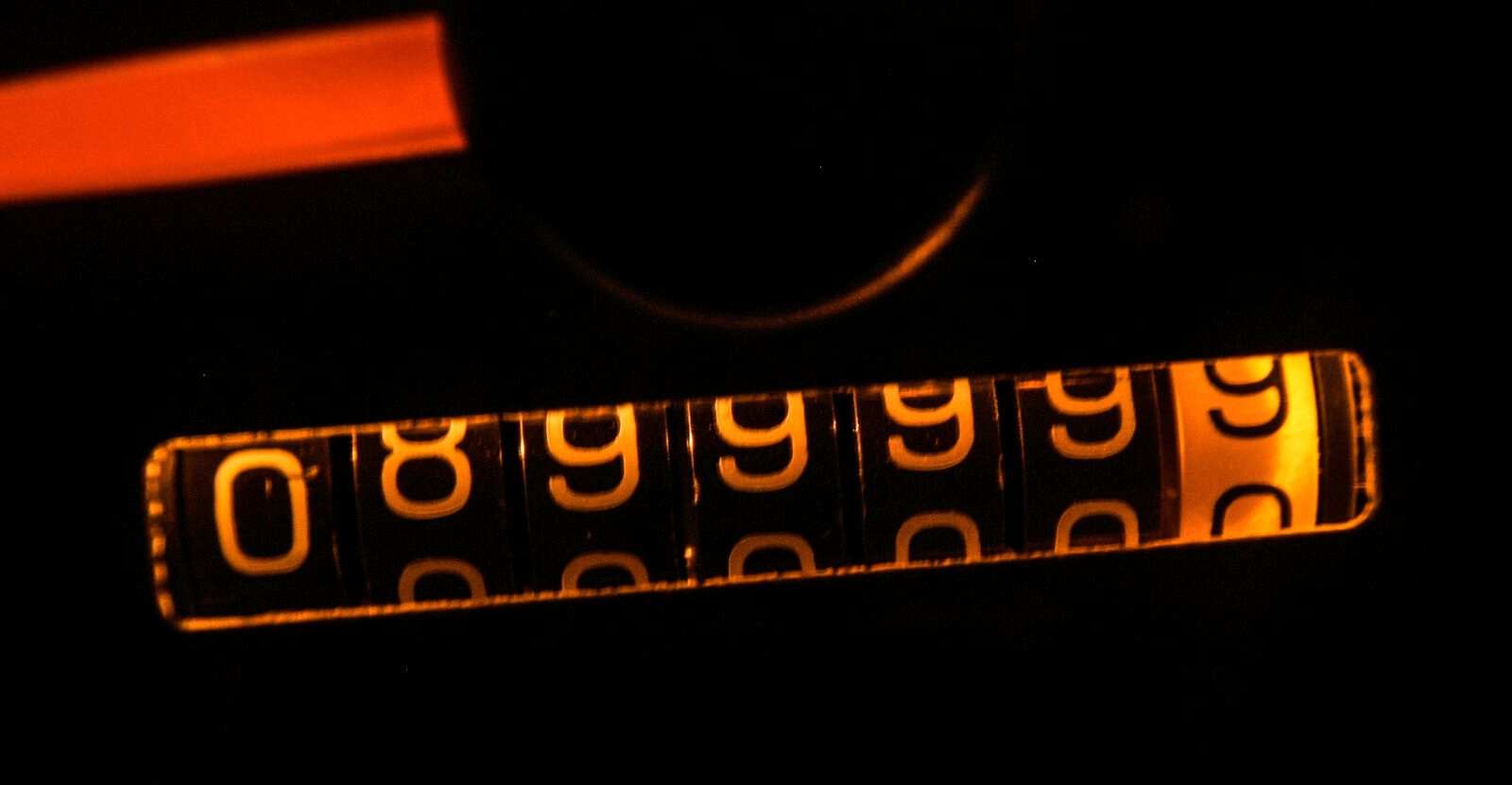A mechanical odometer rolling over